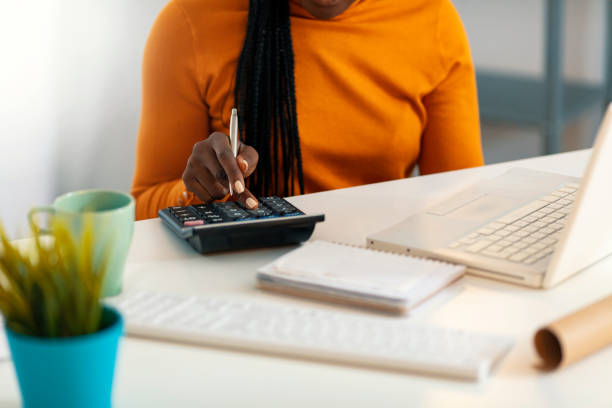 woman using calculator