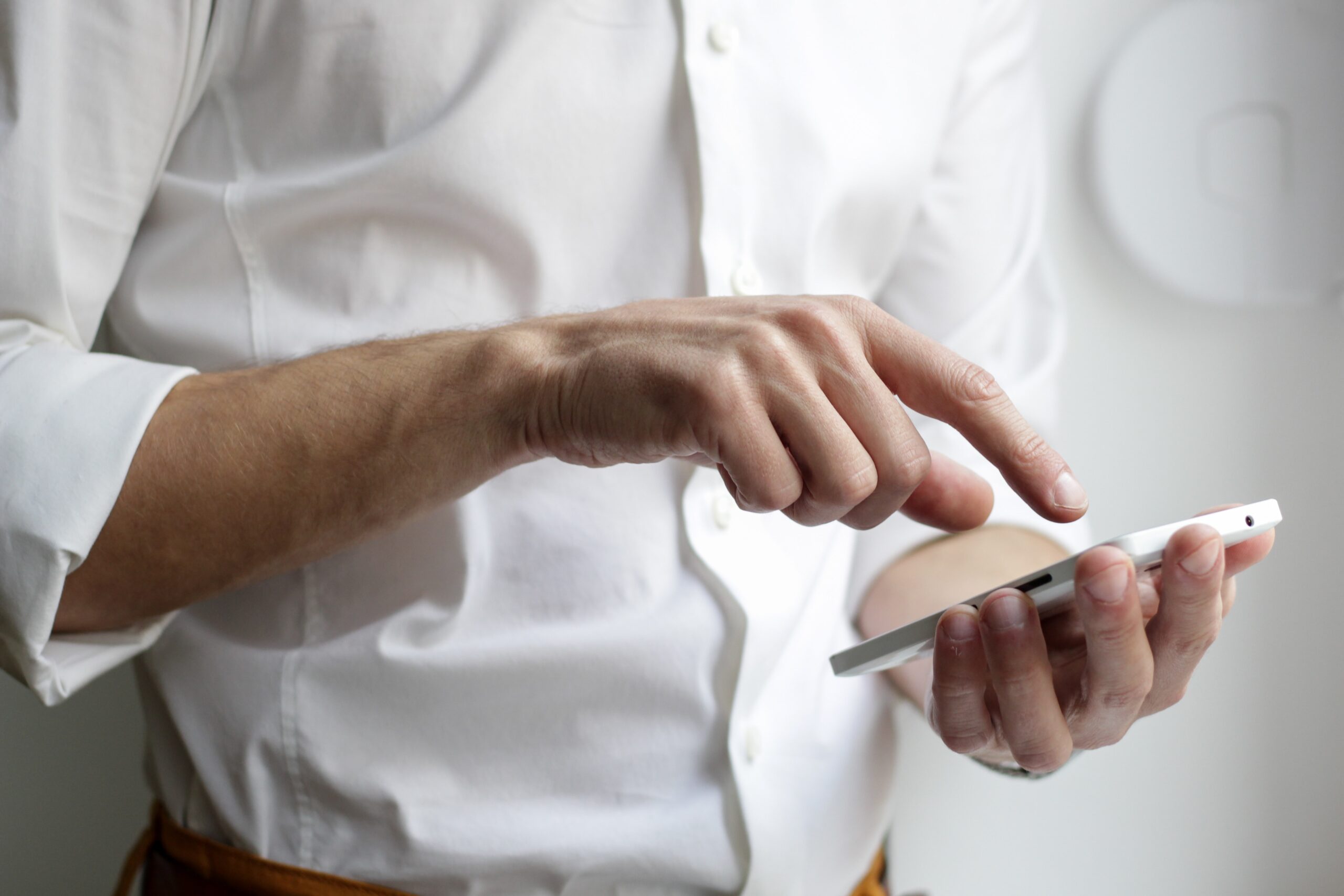 man using his smart phone